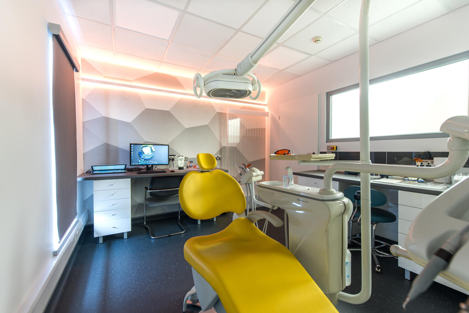 yellow dental office at suir clinic with yellow wall led design