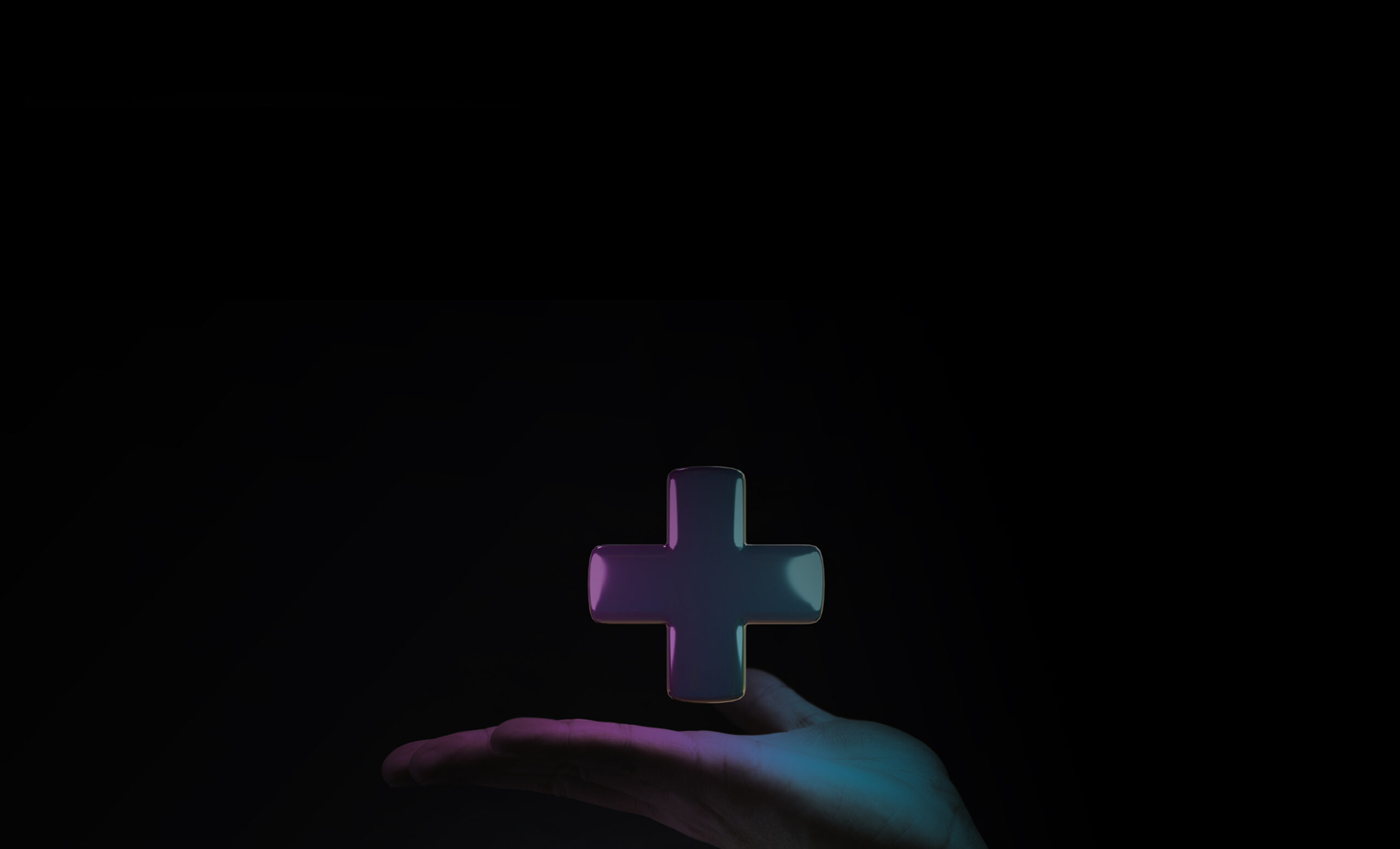 hand holding medical cross